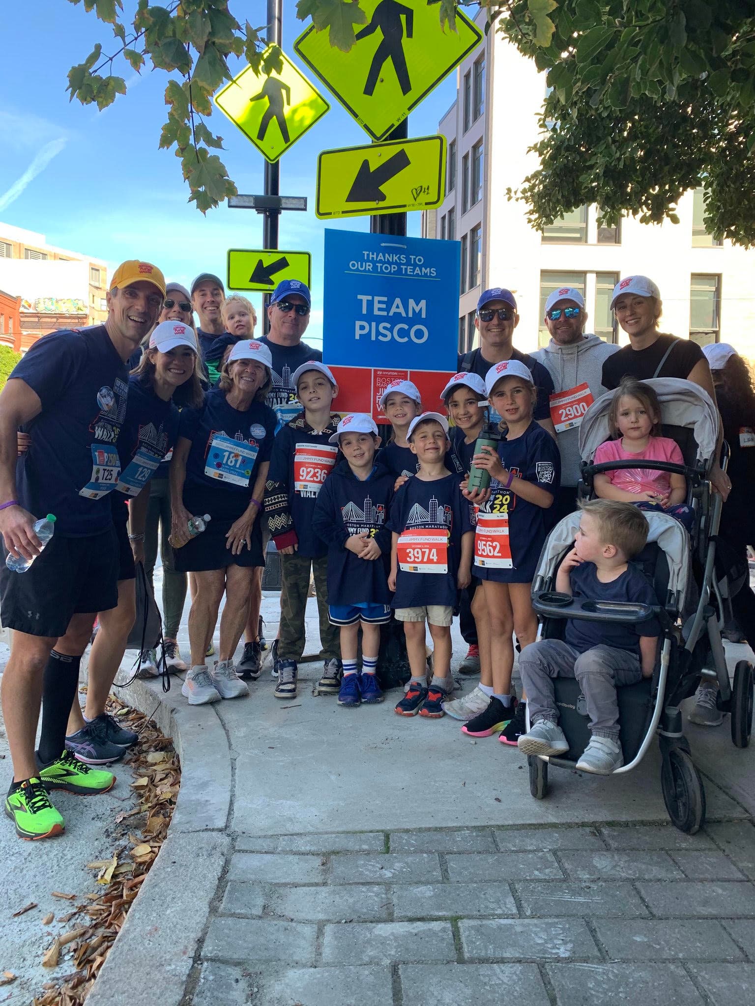 Team Pisco at the Jimmy Fund Walk under the Team Pisco sign